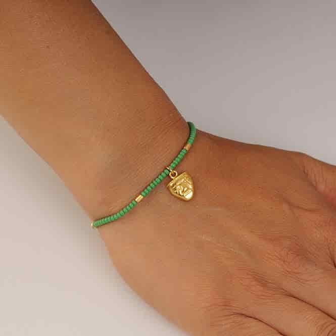 Pulsera Cristal Checo Mini Verde y Dije Mini Cara Humanoide Quimbaya - miniatura 2