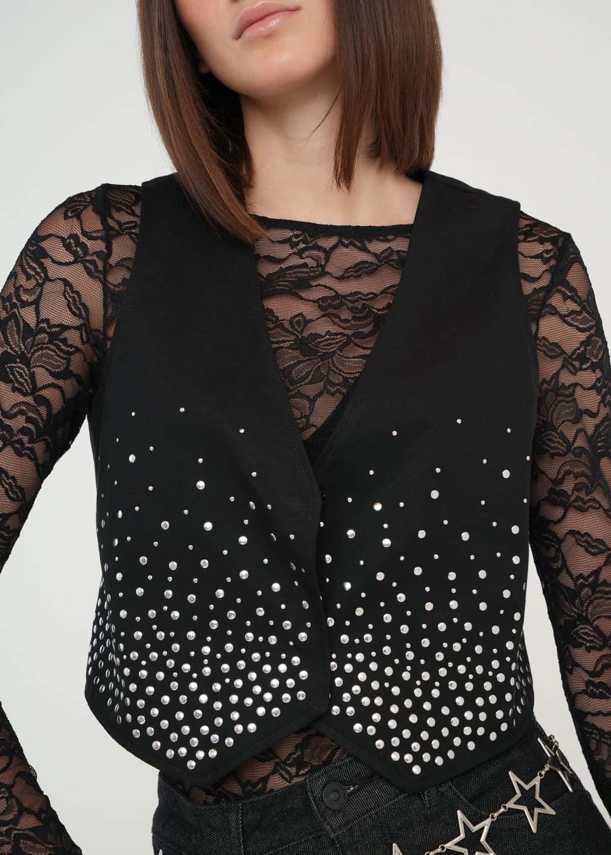 Chaleco con apliques brillantes