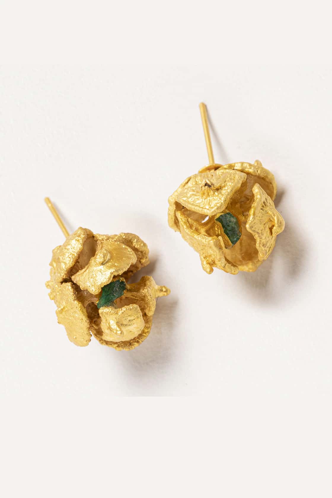 PINE SEEDS AND ROUGH EMERALD STUDS