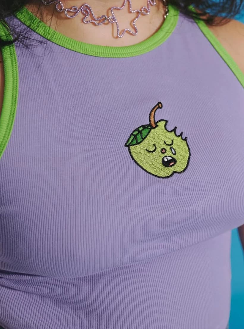 top manzana triste